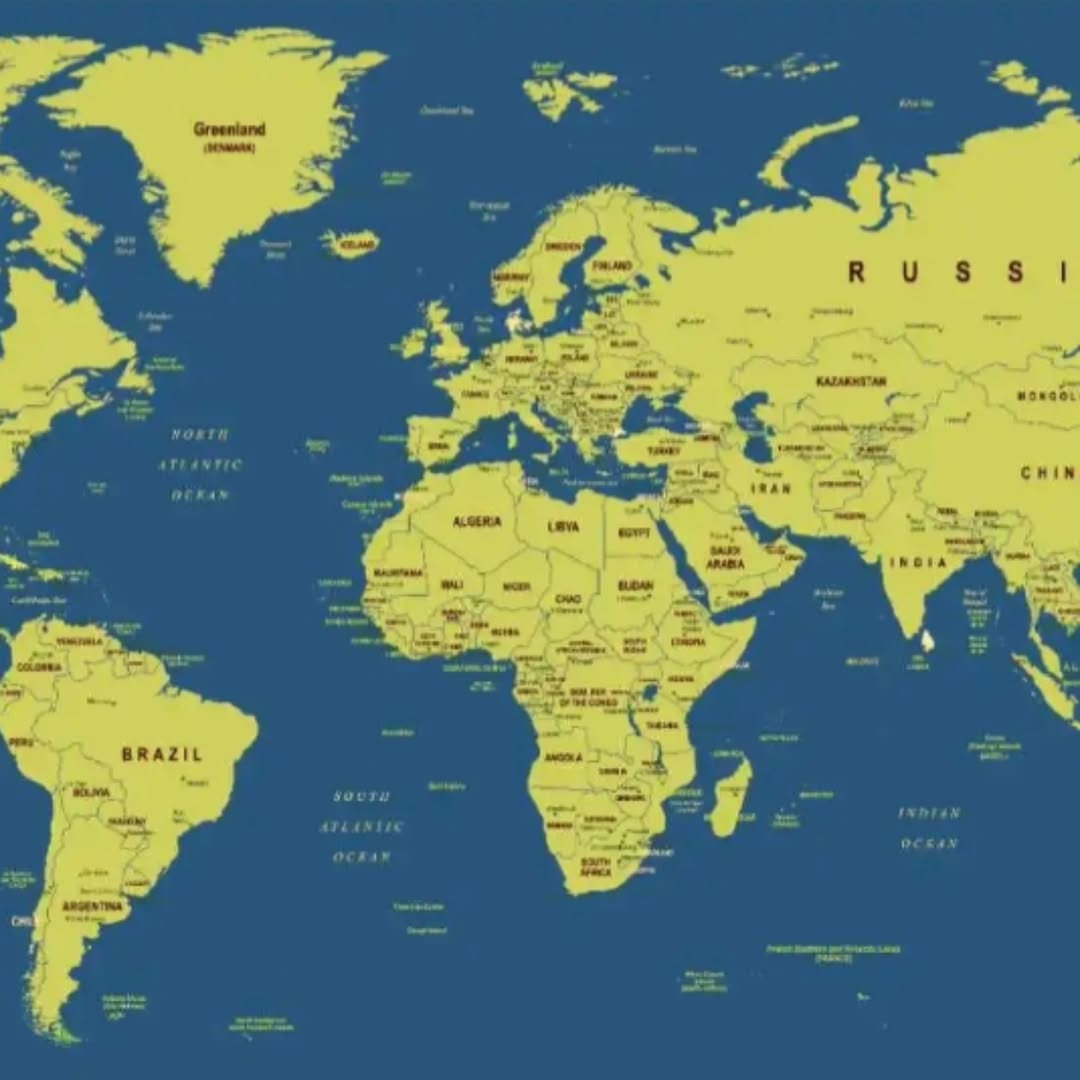 A vibrant world map mural featuring bright yellow continents set against a dark navy blue ocean. The map includes detailed country names and geographi